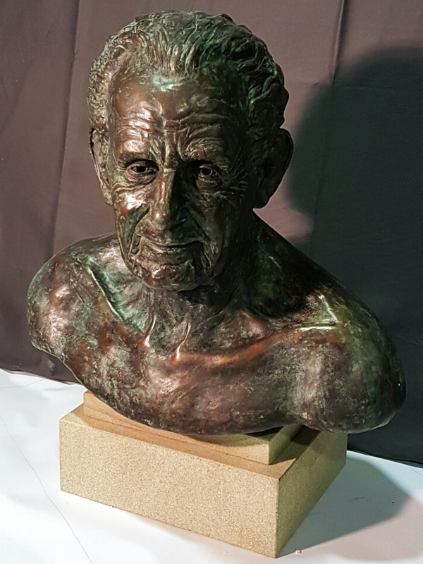 Bronze bust sculpture of male face